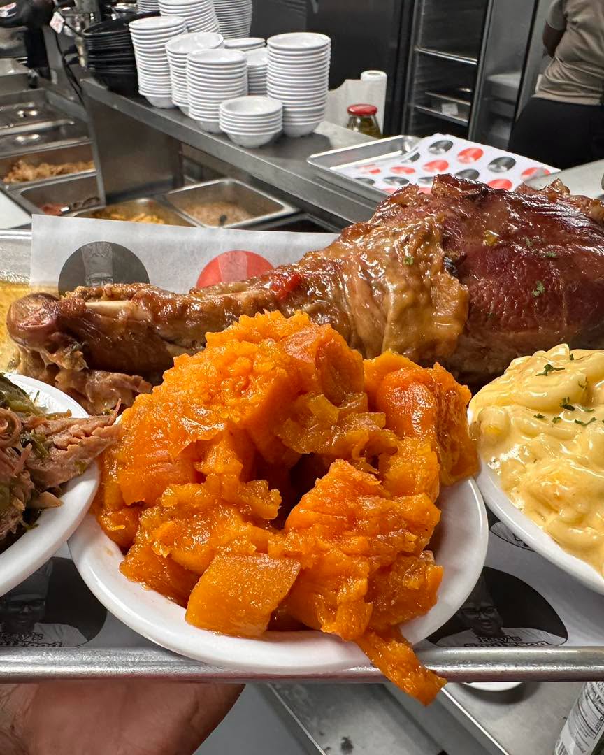Signature stuffed turkey leg with candied yams and mac and cheese