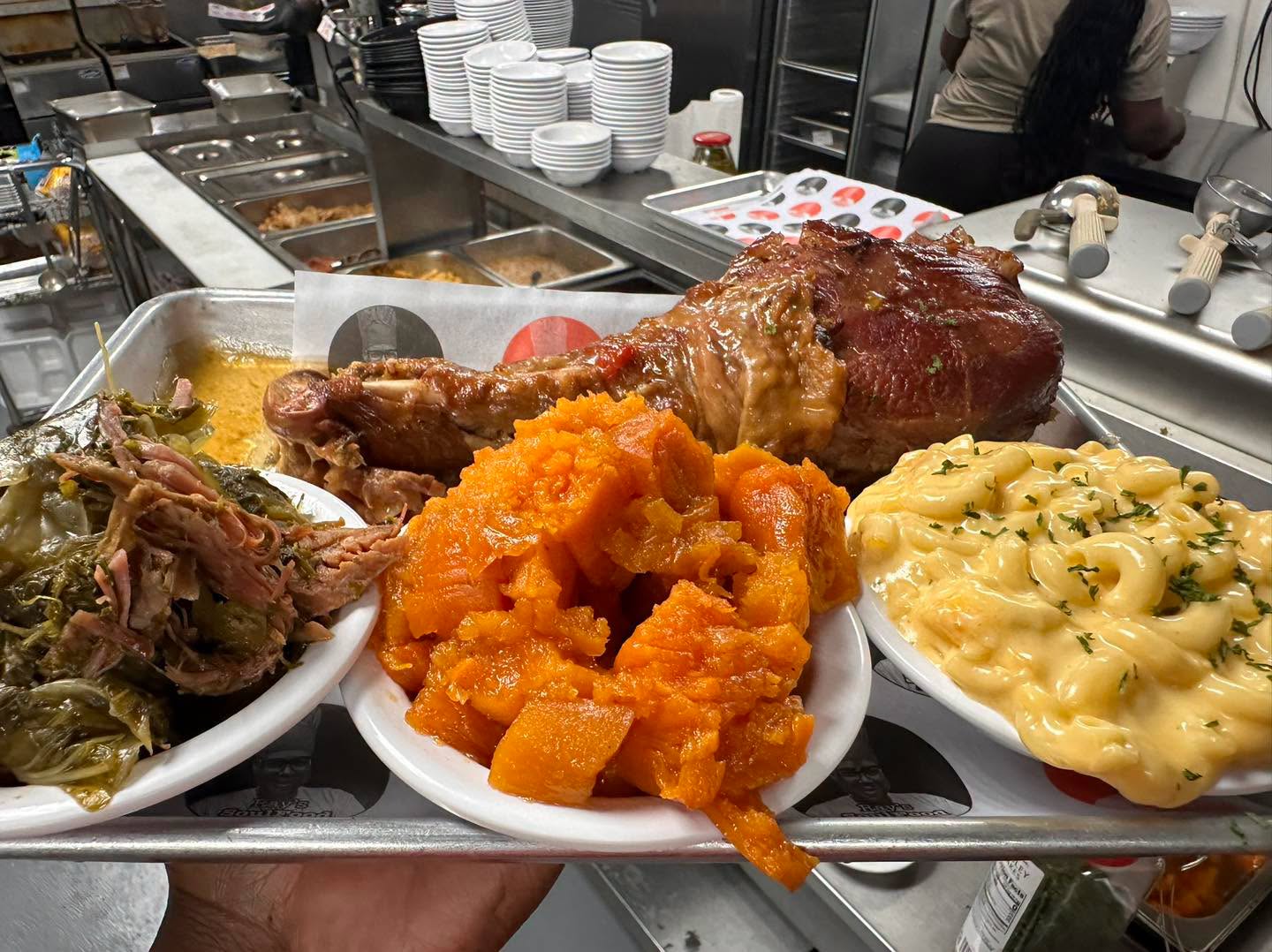 Ray's signature stuffed turkey leg served with collard greens, candied yams, and mac and cheese